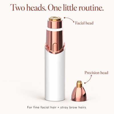 White Neluvra trimmer with its round facial-hair head and separate precision attachment for stray brow hairs.